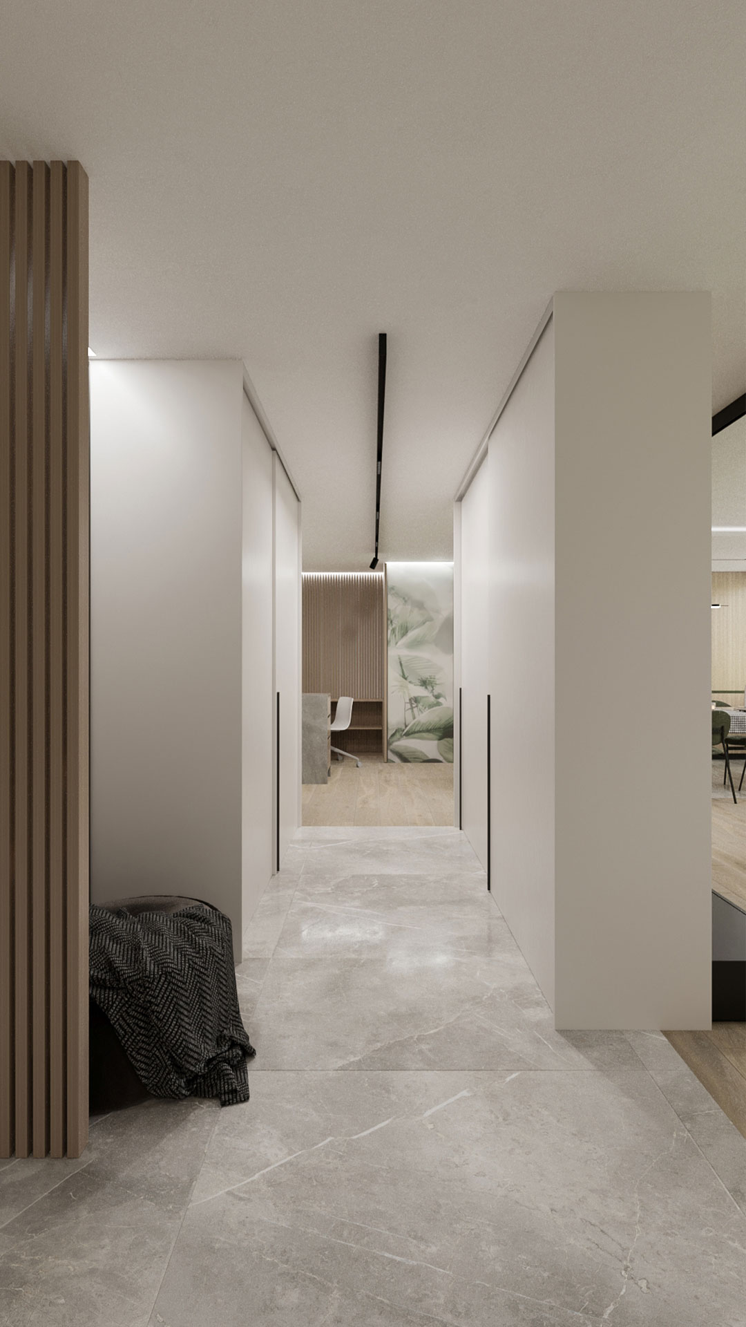 A hallway, with light gray stone floors and white walls, leading to the study