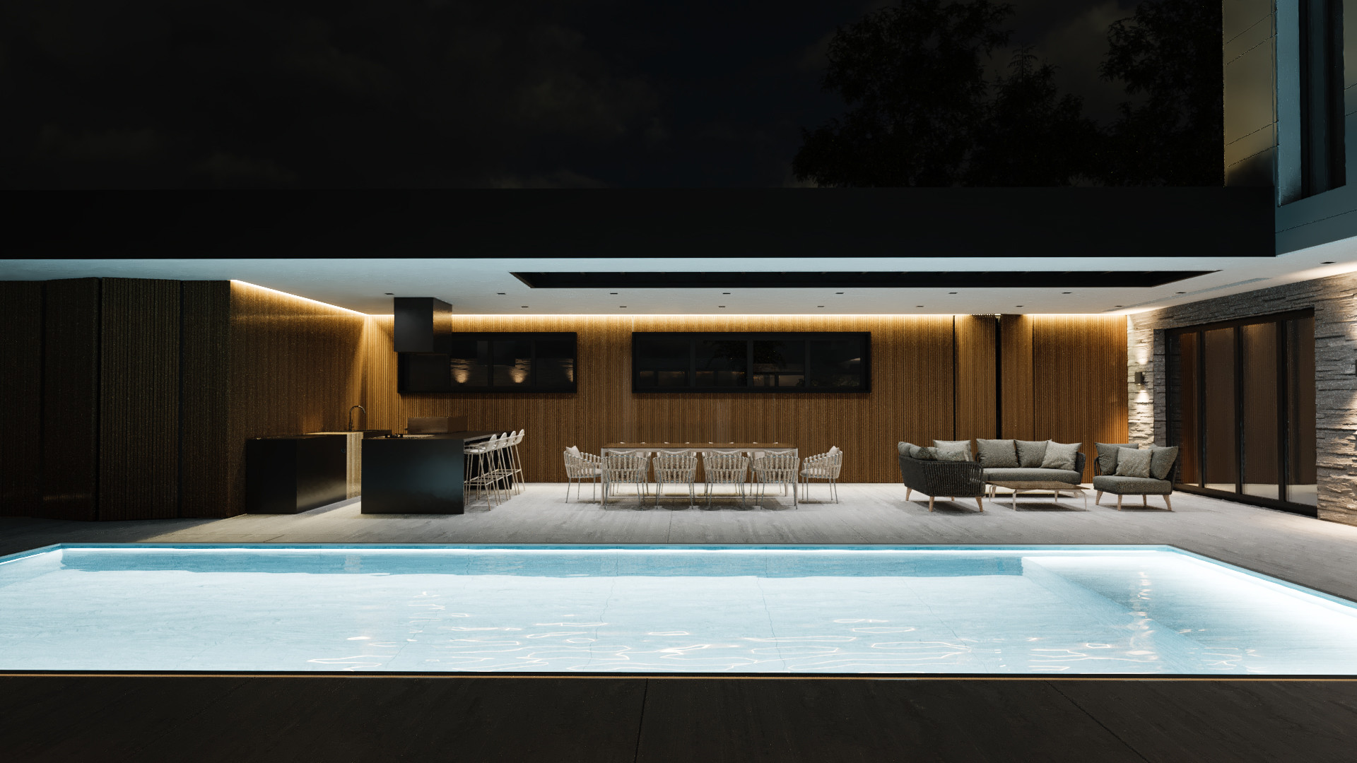 Letna kuhinja z jedilnico in bazenom ob sodobni vili ponoči