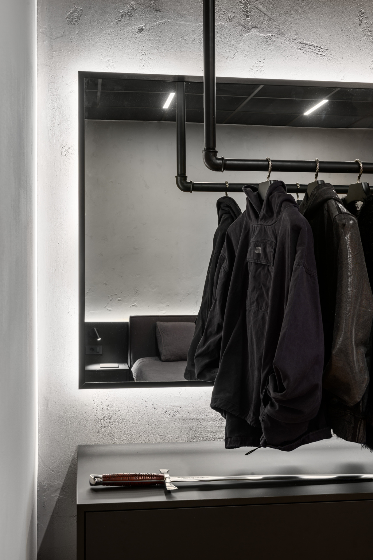 Custom designed industrial wardrobe with a mirror