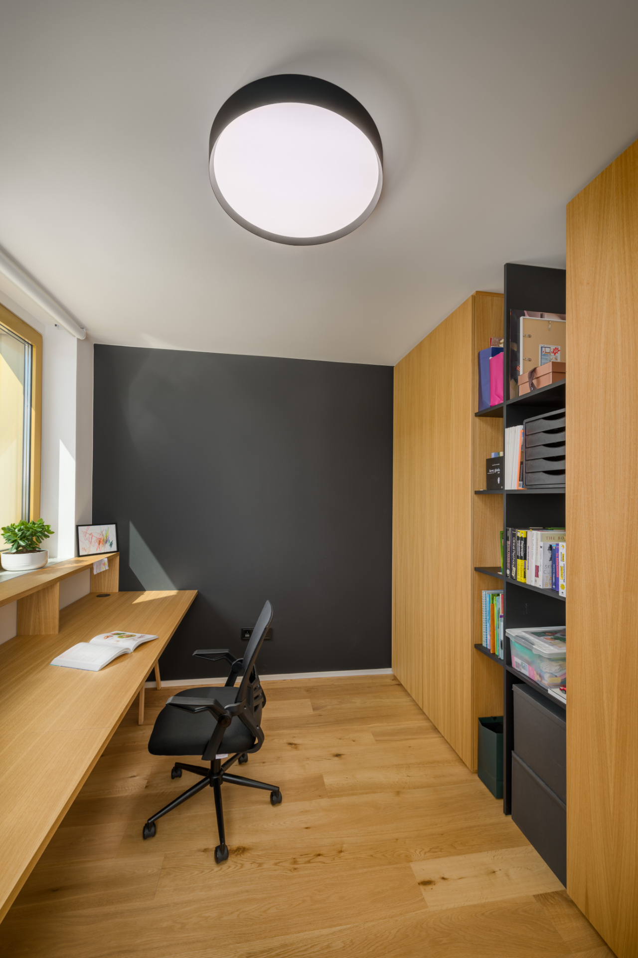 Home office renovation with a built-in wardrobe and a wooden desk