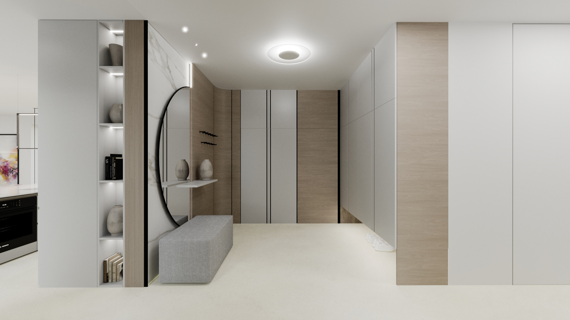 Notranji dizajn vhodnega prostora z okroglim ogledalom in vgrajenim pohištvom