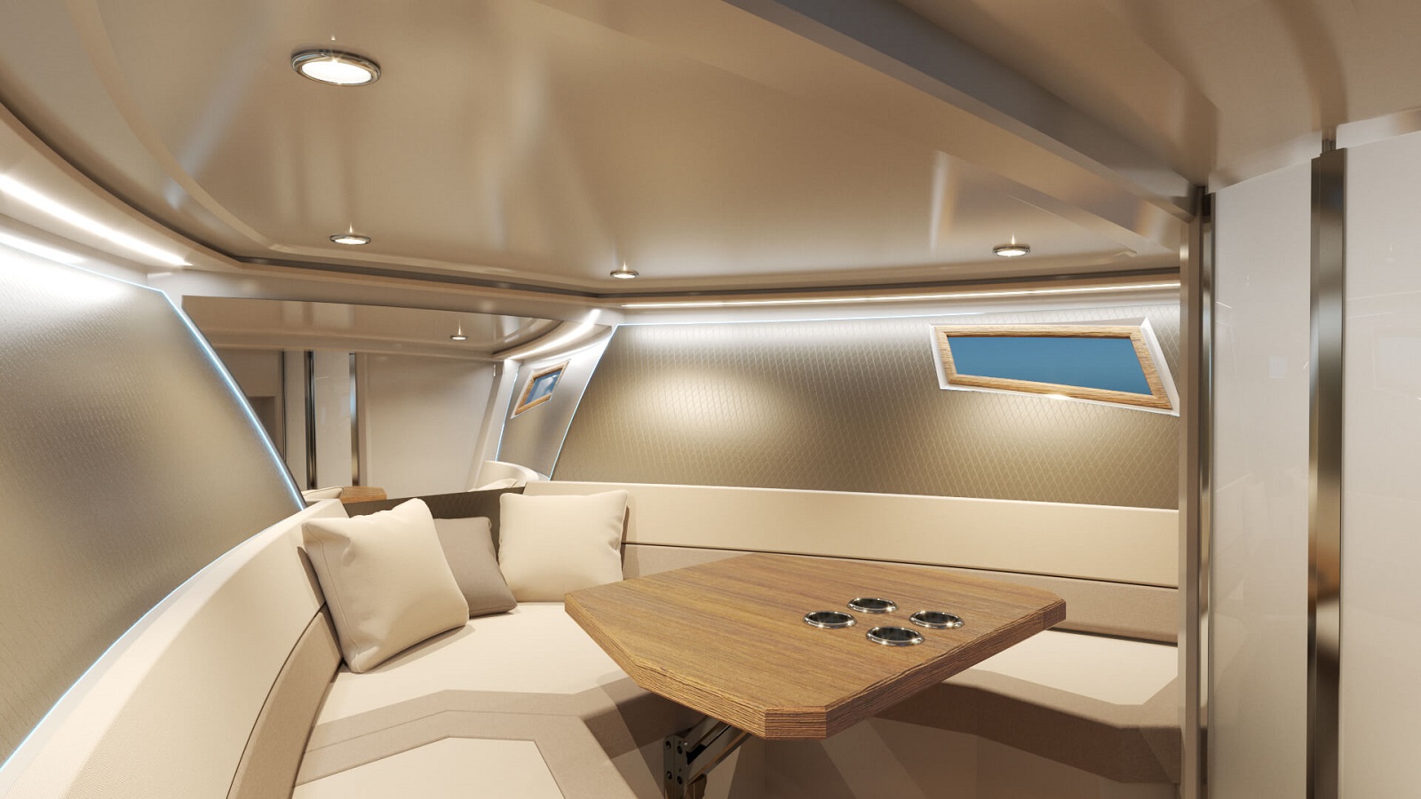 Kabina na motornem čolnu z mizico, oblazinjenimi sedeži in oknom.