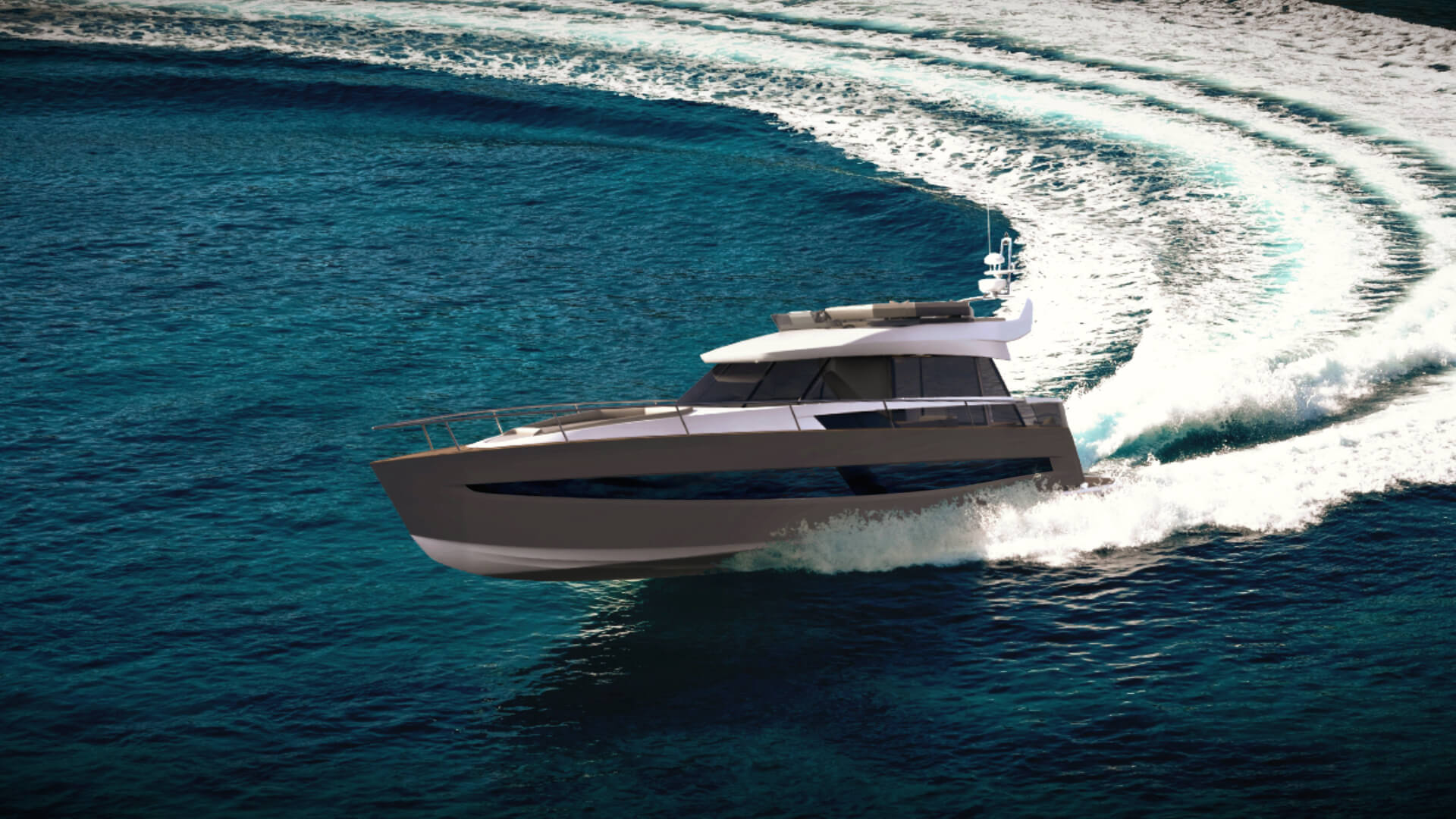 Rjavo-bela hibridna jahta, ki na morju zavija v oster ovinek in ustvarja dinamične vzorce na vodi