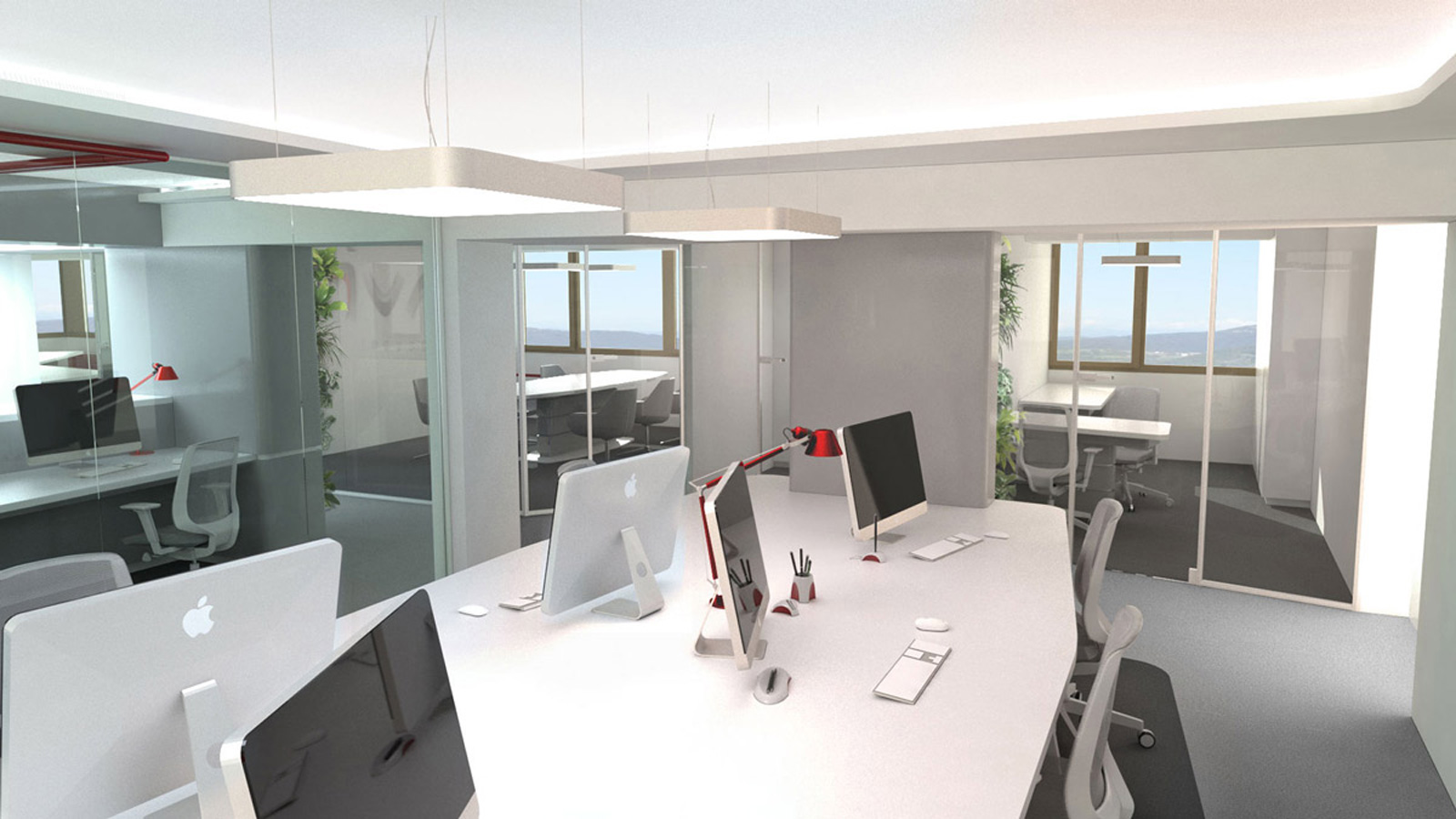 Svetli poslovni prostori podjetja Livar z belimi mizami, belimi stoli in računalniki