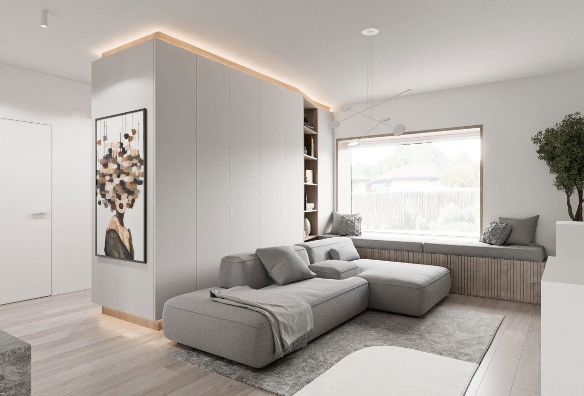 Svetla dnevna soba s kavčem in pregradno garderobno omaro v beli barvi